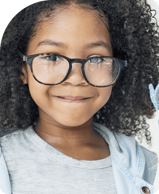 Little girl smiling wearing glasses